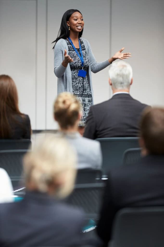 Young professional speaking during a leadership presentation